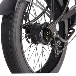 Close-up of the Chico GT7 750W Stretch Cruiser Ebike's rear wheel with fat tire and black rim.